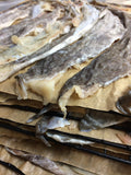 Fresh wild Alaska cod skins ready for drying.